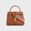 Correa larga de lana con jacquard de CELINE y acabado dorado Correa larga de lana con jacquard de CELINE y acabado dorado