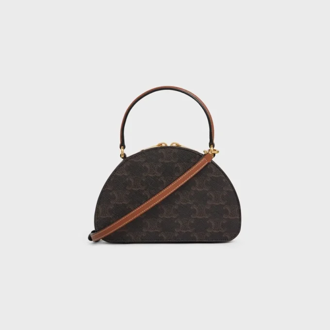 Estuche Half Moon en Triomphe Canvas y piel de becerro Estuche Half Moon en Triomphe Canvas y piel de becerro