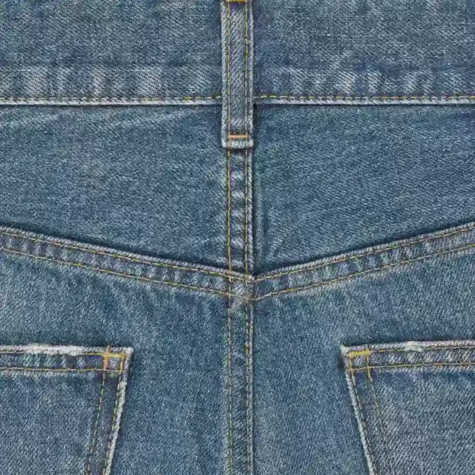 Jeans acampanados Dylan con firma en denim de algodón Jeans acampanados Dylan con firma en denim de algodón