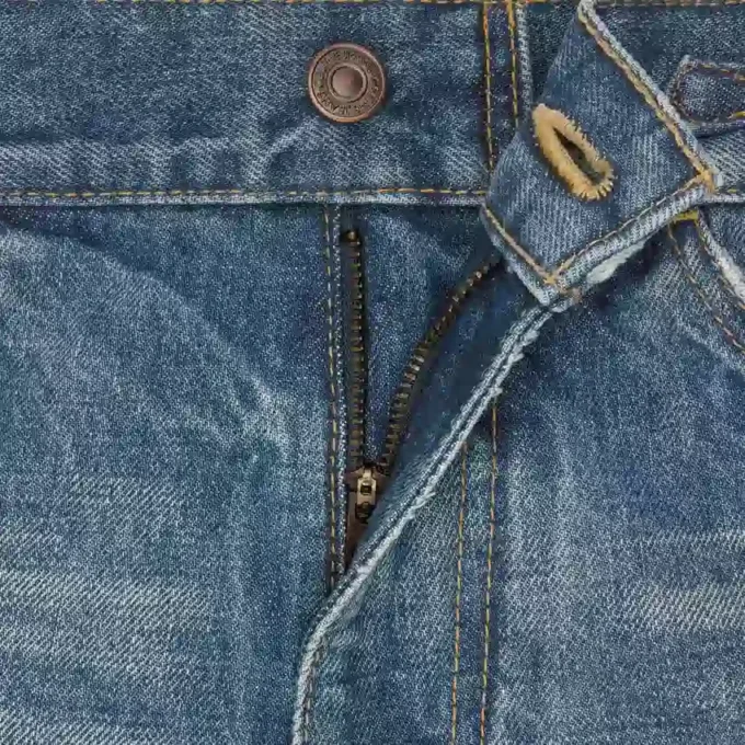Jeans acampanados Dylan con firma en denim de algodón Jeans acampanados Dylan con firma en denim de algodón