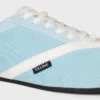 Las zapatillas planas en grosgrain, terciopelo, piel de cabra y piel de cordero