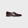 Mocasines CELINE Malaquais Penny Triomphe en piel de toro pulida Mocasines CELINE Malaquais Penny Triomphe en piel de toro pulida