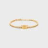 Pulsera articulada Triomphe con brillos en strass y latón con acabado dorado Pulsera articulada Triomphe con brillos en strass y latón con acabado dorado