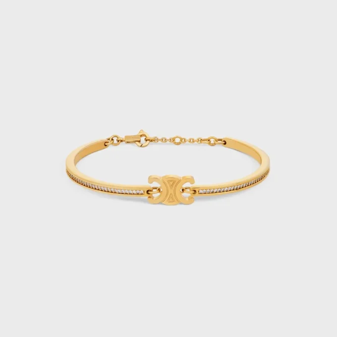 Pulsera articulada Triomphe con brillos en strass y latón con acabado dorado Pulsera articulada Triomphe con brillos en strass y latón con acabado dorado
