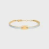 Pulsera articulada Triomphe en esmalte y latón con acabado dorado Pulsera articulada Triomphe en esmalte y latón con acabado dorado