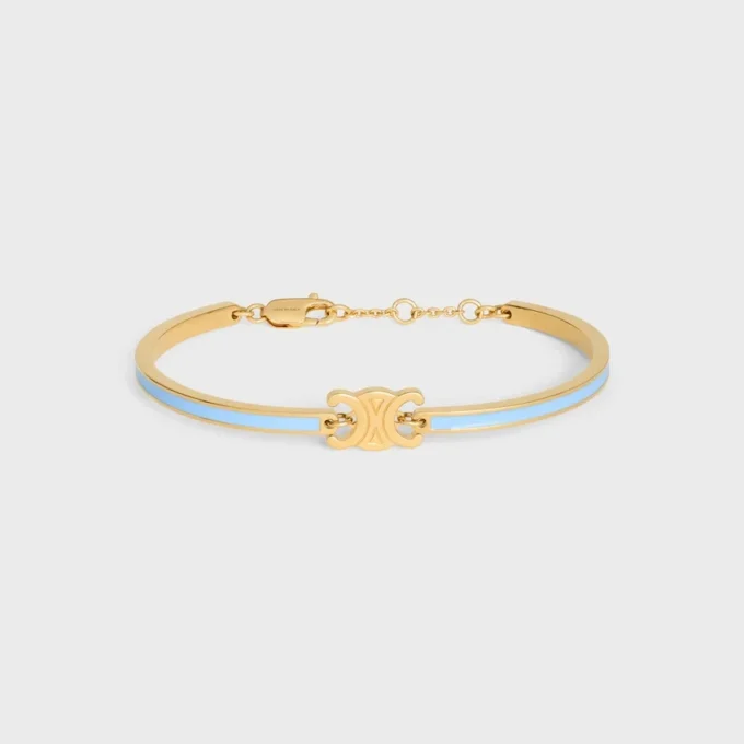 Pulsera articulada Triomphe en esmalte y latón con acabado dorado Pulsera articulada Triomphe en esmalte y latón con acabado dorado