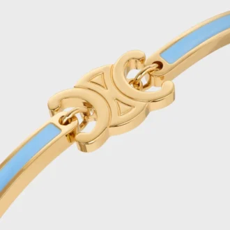 Pulsera articulada Triomphe en esmalte y latón con acabado dorado