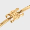 Pulsera articulada Triomphe en latón con acabado dorado Pulsera articulada Triomphe en latón con acabado dorado
