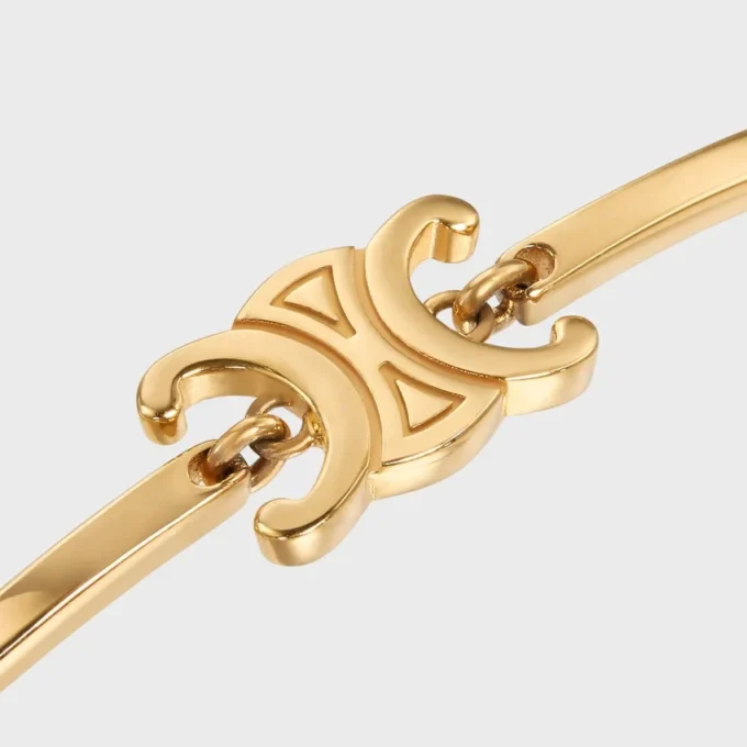 Pulsera articulada Triomphe en latón con acabado dorado Pulsera articulada Triomphe en latón con acabado dorado