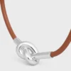 Pulsera con nudo en piel de becerro y latón con acabado de rodio