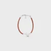 Pulsera con nudo en piel de becerro y latón con acabado de rodio