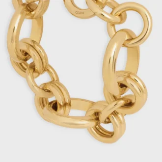 Pulsera gruesa CELINE Charms Heritage en latón con acabado dorado