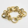 Pulsera gruesa CELINE Charms Heritage en latón con acabado dorado