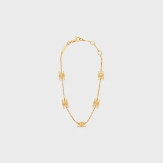 Pulsera Triomphe Mini Triomphe en latón con acabado dorado