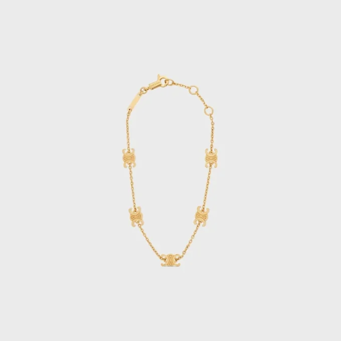 Pulsera Triomphe Mini Triomphe en latón con acabado dorado Pulsera Triomphe Mini Triomphe en latón con acabado dorado